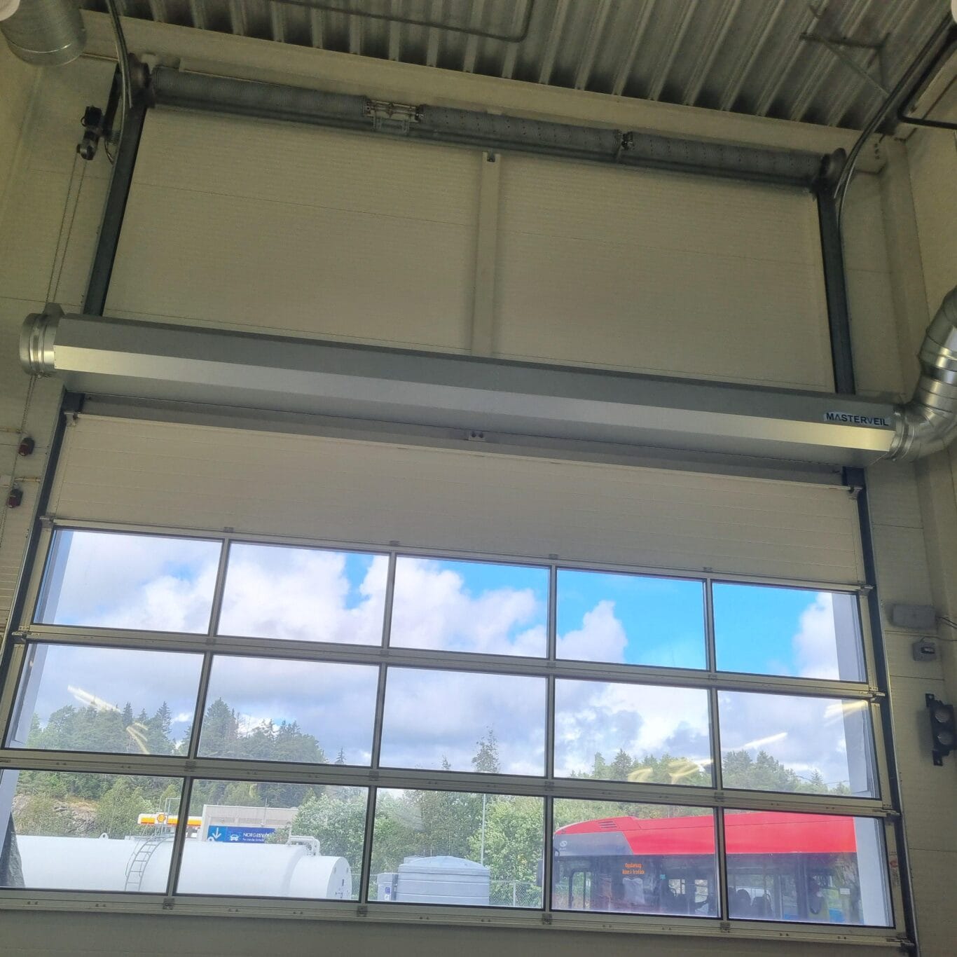 A closeup of a masterveil airstop air curtain drum at a carwash